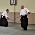Sensei Walters and Sensei O'Connell demonstrating the paired jo kata