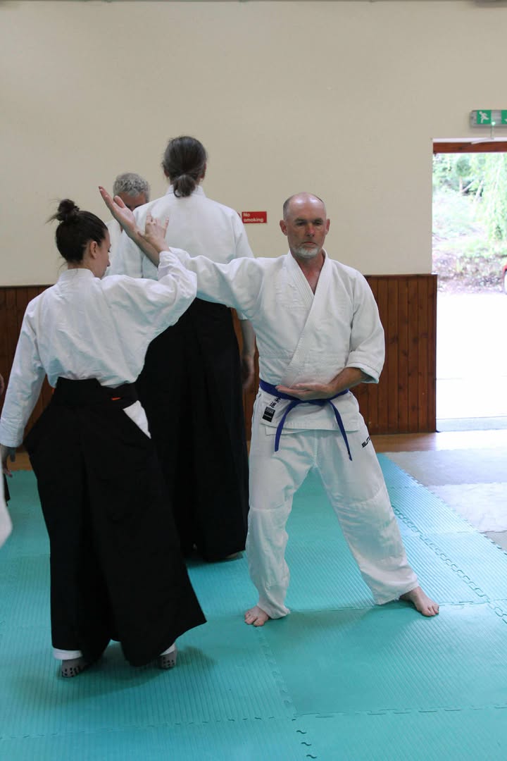 Two students testing for stability in the sideways exercise.