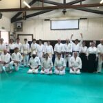 A group portrait of delighted (relieved?) students having passed their gradings.