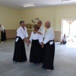 One student, held by three others at once, wonders what she's going to do next