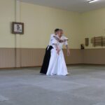 Sensei O'Connell demonstrating that he has taken his partner's balance and that, therefore, he's free to move.