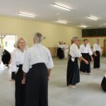 Students preparing to attack 5th form, others rolling after being deflected to the ground.