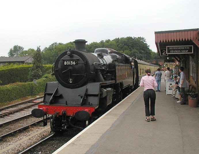 A steam train at a platform on the West Somerset railway line.